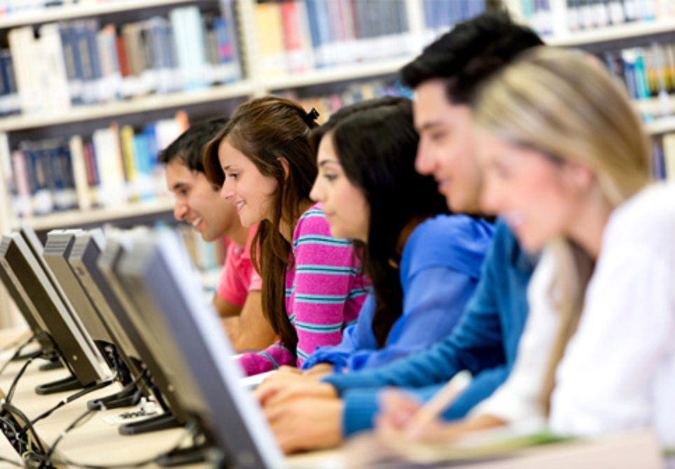 computer-class-with-students-at-desk-inside-library-or-reference-section