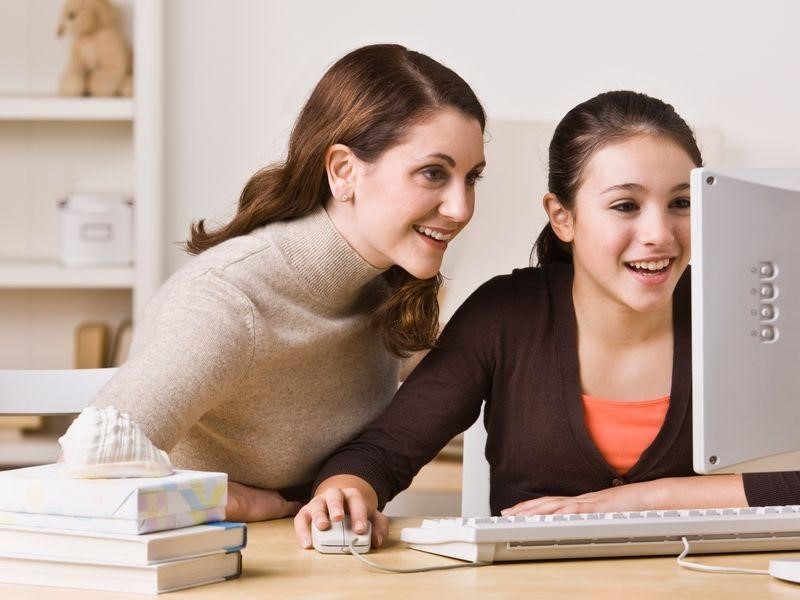 Mother able to listen in during her daughters online tutoring lesson